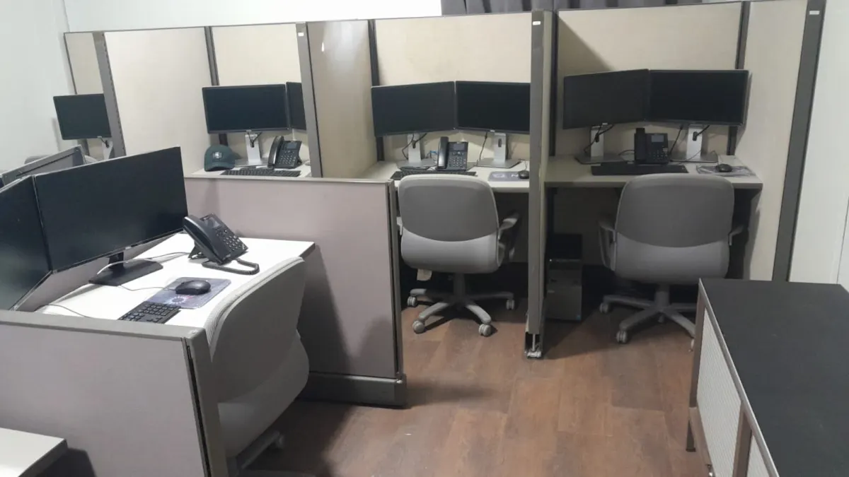 Agent workstations at the KCG BPO office in Kingston